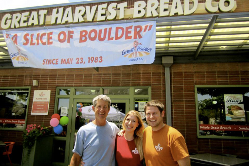 Happy family in front of Great Harvest Bread Co