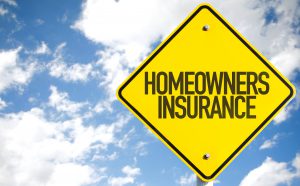 Homeowners Insurance sign with sky background